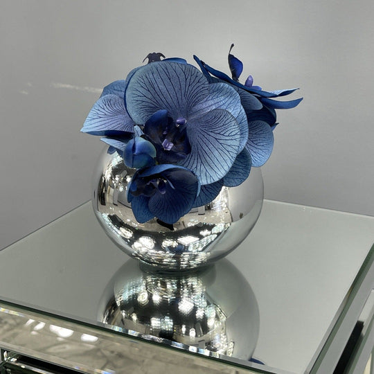 Blue orchid in a silver bowl