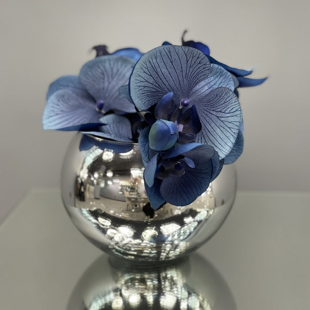 Blue orchid in a silver bowl